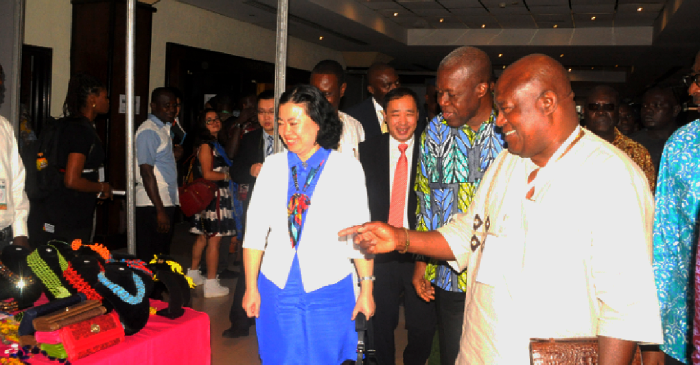 Mr Gideon Quarcoo (right), Chief Executive Officer of the Ghana Export Promotion Authority, explaining a point to Vice-President Kwesi Amissah Arthur (2nd right) and Ms Sun Baohong (left), the Chinese Ambassador to Ghana, during an inspection of product exhibitions in Accra. Picture: Gabriel Ahiabor